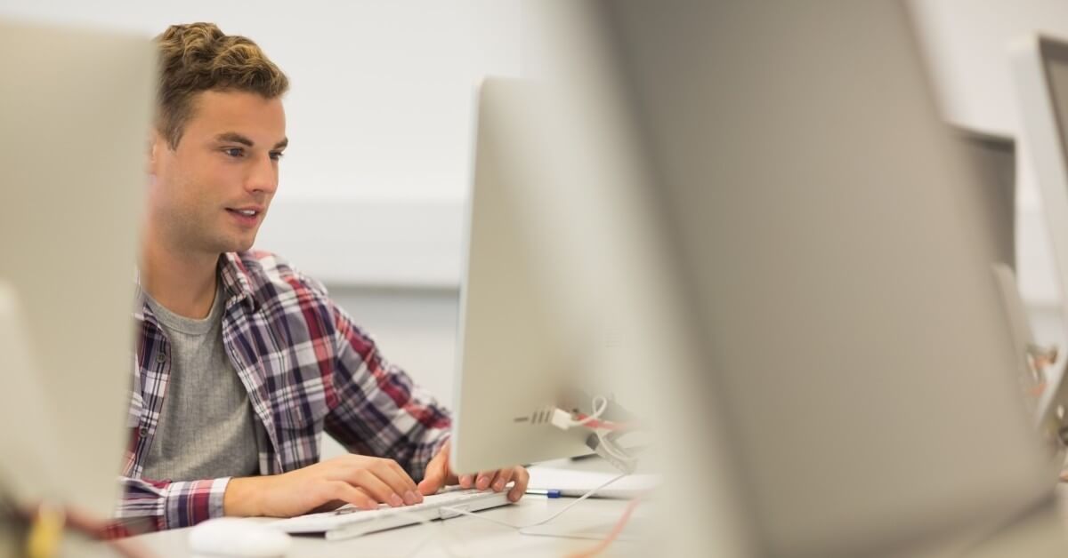 a person studying for EPA certification at a computer